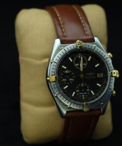Reloj Breitling de caballero. Acero y oro con pulsera de piel. Cronómetro. Automático.