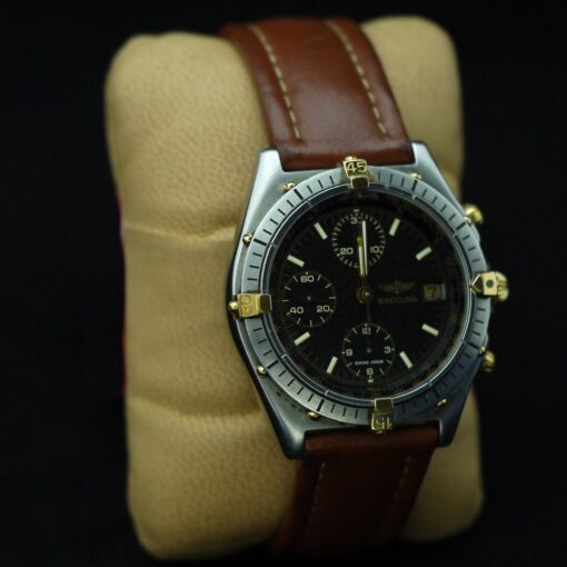 Reloj Breitling de caballero. Acero y oro con pulsera de piel. Cronómetro. Automático.