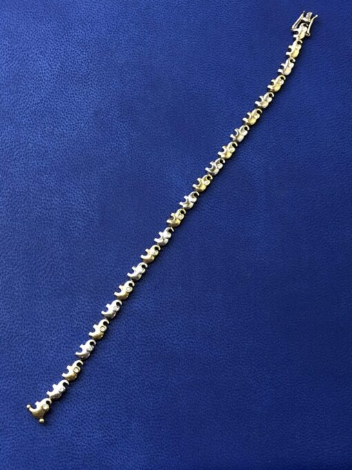 Pulsera con elefantes y brillantes. Montada en oro bicolor de 18 Ktes. - Imagen 2