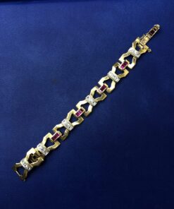 Pulsera Art-Decó de rubíes sintéticos y brillantes montado en oro bicolor de ley 18kts
