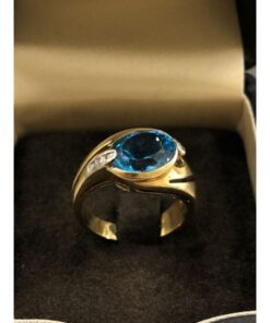 Sortija con piedra azul central símil de topacio