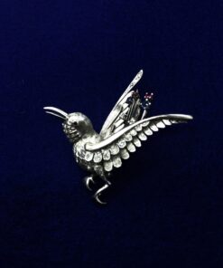 Broche pájaro con brillantes montado en oro blanco  de ley 18kts