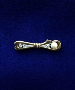 Broche con una perla y brillantes montado en oro amarillo de ley 18kts