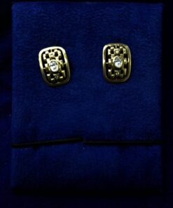 Gemelos con circonita central montados en oro amarillo de ley 18kts