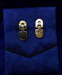 Gemelos con circonita central  montados en oro amarillo de ley 18kts