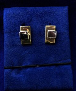 Gemelos forma rectangular con cuadrado central  montados en oro  bicolor de ley 18kts