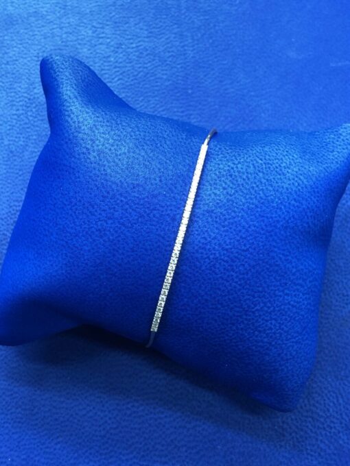 Pulsera  caña con brillantes ,030 cts montado en oro amarillo de ley 18kts