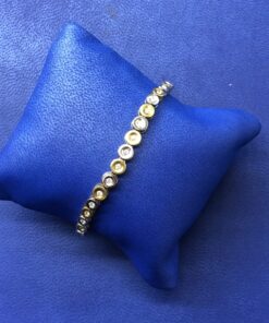 Pulsera con círculos con brillantes 1cts montado en oro bicolor de ley 18kts