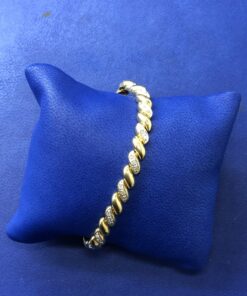 Pulsera espiral  montado en oro bicolor de ley 18kts