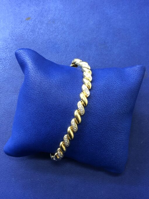 Pulsera espiral  montado en oro bicolor de ley 18kts