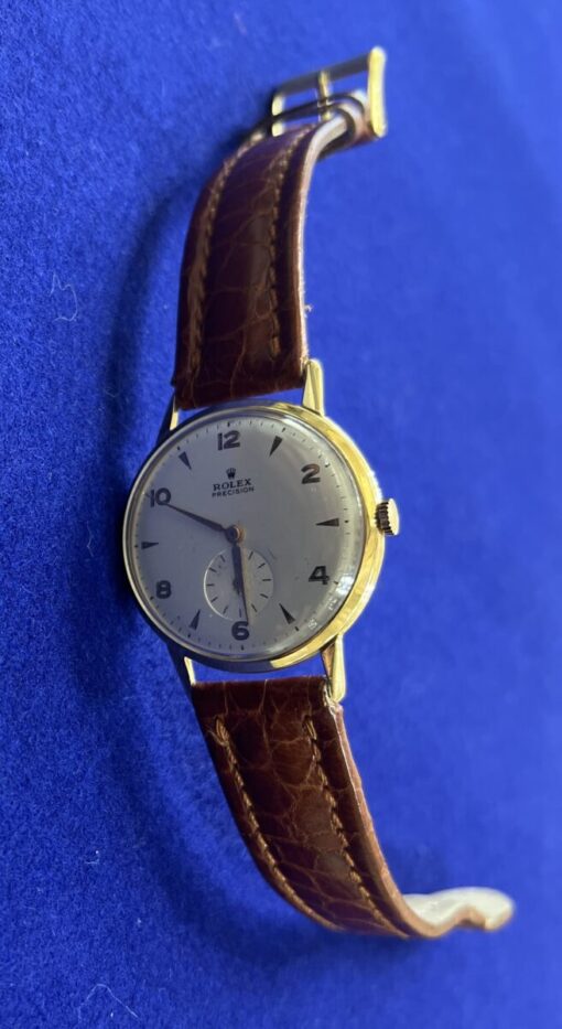 Reloj Rolex Vintage Precisión con correa de cuero marrón, montado en oro amarillo de 18 kts. De cuerda manual