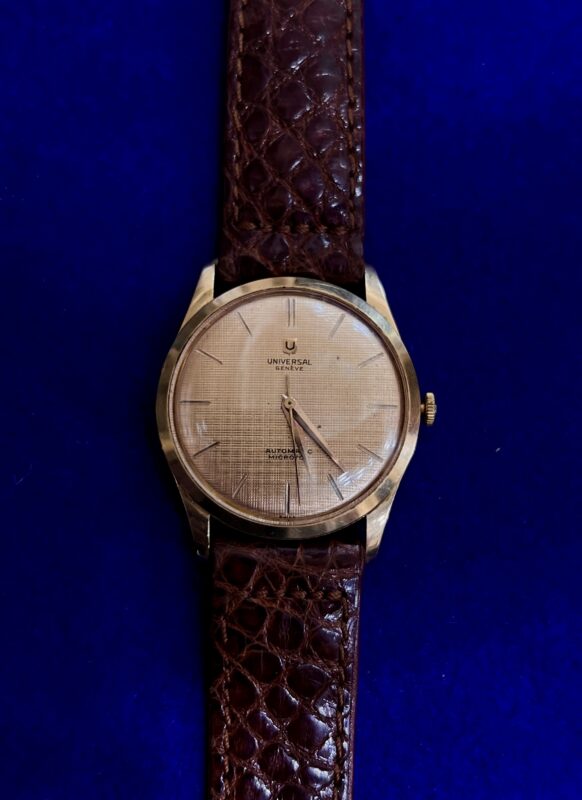 RELOJ AUTOMÁTICO UNIVERSAL GENEVE DE ORO 18 KTS. CON PULSERA DE PIEL UNISEX