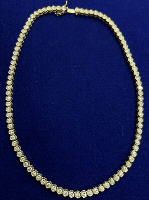 GARGANTILLA RIVIER CON BRILLANTES 9´60CTS CHATON . MONTADO EN ORO DE LEY AMARILLO 18KTS.