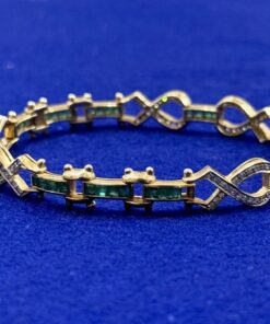 PULSERA CON BRILLANTES 1,45CTS Y ESMERALDAS COLOMBIANAS 1,30CTS. MONTADA EN ORO AMARILLO DE LEY 18KTS.