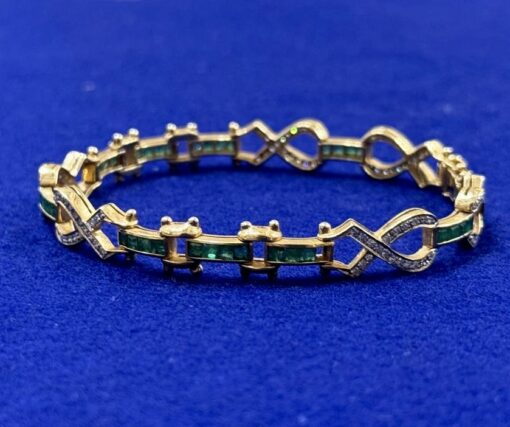 PULSERA CON BRILLANTES 1,45CTS Y ESMERALDAS COLOMBIANAS 1,30CTS. MONTADA EN ORO AMARILLO DE LEY 18KTS.