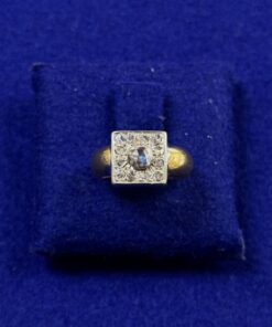 Sortija cuadrada con brillantes montada en oro bicolor de ley 18kts.