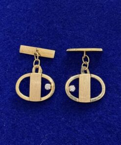 Gemelos ovalados con circonitas. Montados en oro amarillo de ley 18kts.