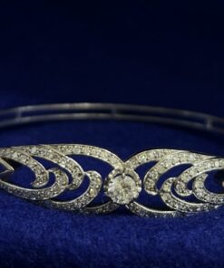 PULSERA RÍGIDA CON BRILLANTES. MONTADA EN ORO BLANCO DE LEY 18KTS.