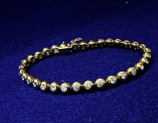 PULSERA RIVIERE CHATON DE BRILLANTES 1,96CTS. MONTADA EN ORO AMARILLO DE LEY 18KTS.