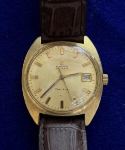 RELOJ OMEGA AUTOMÁTICO. DE ORO 18KTS Y PULSERA DE PIEL MARRÓN.