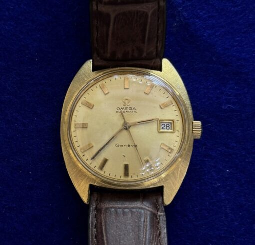 RELOJ OMEGA AUTOMÁTICO. DE ORO 18KTS Y PULSERA DE PIEL MARRÓN.
