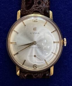 RELOJ CYMA FLEX DE CUERDA. CON SEGUNDERO A LAS 6. EN ORO 18KTS Y PULSERA DE PIEL.