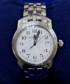 RELOJ BAUME & MERCIER GENEVE. ESFERA BLANCA, DE CUARZO Y ACERO. REF:MV045214
