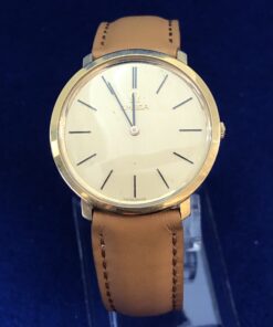 RELOJ OMEGA AUTOMÁTICO, EN ORO AMARILLO DE LEY 18KTS Y  ESFERA DORADA. PULSERA DE PIEL CAMEL