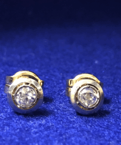 Pendientes dormilonas de brillantes 0,30 cts (total) montados en chatón bicolor de oro de ley 18 kts