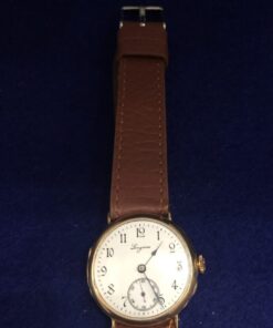 Reloj Longines de caballero, vintage (años 50), caja en oro de ley 18 kts. y correa de piel color marrón, 30mm.