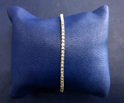 Pulsera rivière con 0'60 cts de brillantes en oro blanco de ley 18 kts.