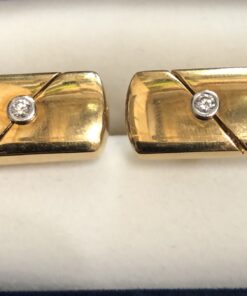 Gemelos con brillantes en oro amarillo de ley 18 kts.