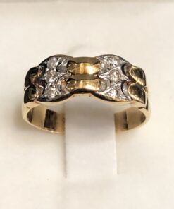 Sortija bicolor con dos columnas de brillantes (0,08 cts aprox.), en oro de ley 18 kts.