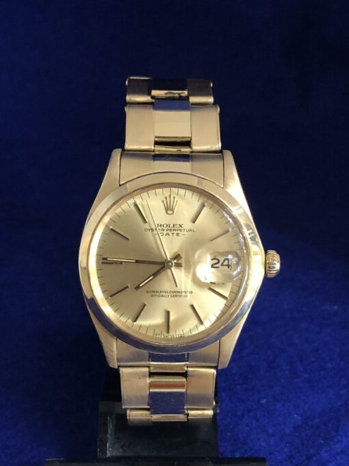 Rolex Oyster Perpetual Date, tamaño cadete (34 mm), esfera champagne, en oro amarillo de ley 18 kts., automático, año 1962.