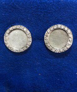 Gemelos circulares con orla de brillantes (0.40 cts en total) en oro blanco de ley 18 kts.