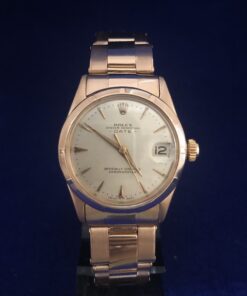 Rolex Oyster Perpetual Date en oro rosa de ley 18 kts., 31 mm., movimiento de cuerda manual, esfera argenté, año 1959.