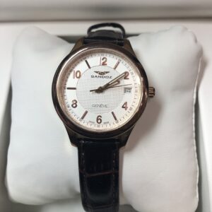 Reloj Sandoz Modelo 81312-0058, 31mm, calendario y  agujas luminiscentes, mecanismo de cuarzo. Maquinaria suiza y cristal de zafiro. De acero con baño de oro rosa.