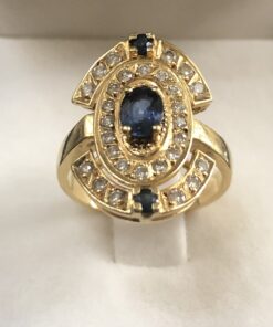 Sortija lanzadera con zafiros finos y brillantes, en oro amarillo de ley 18 kts.