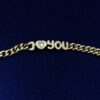Pulsera Chopard modelo "I love you" Happy Diamonds, en oro de ley 18 kts, con contrastes originales de la marca.
