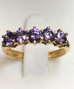 Cintillo de amatistas en oro amarillo de ley 18 kts.