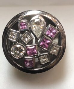 Sortija circular con 0'80 cts de brillantes en total y turmalinas rosas en oro blanco de ley 18 kts.