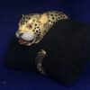 Brazalete vintage (años 80) en forma de leopardo con ojos de rubí y detalles de brillantes, en oro macizo de ley 18 kts.