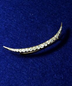 Broche en forma de media luna con aprox. 1'60 cts. de brillantes en oro amarillo de ley 18 kts.