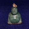 Colgante en forma de Buda realizado en jade y detalles en oro amarillo de ley 18 kts.