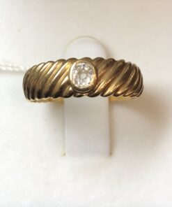 Sortija gallonada vintage (años 80) con brillante de 0'30 cts en oro amarillo de ley 18 kts.