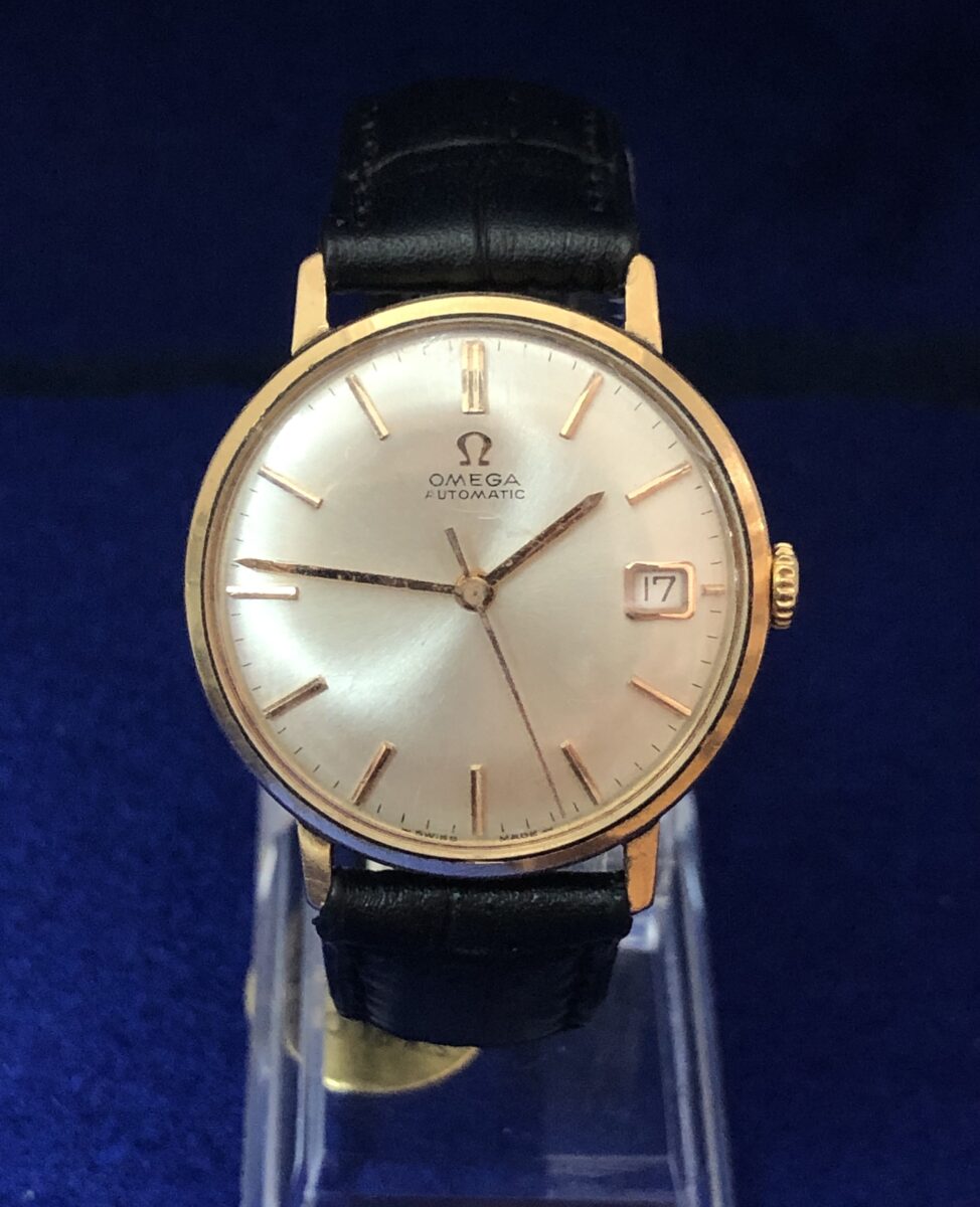Reloj Omega vintage, de caballero, esfera de 34 mm, con fecha, en oro de ley 18 kts con pulsera de piel genuina, automático.