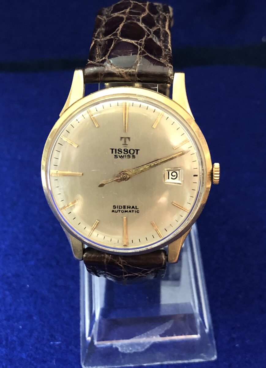 Reloj TISSOT SIDERAL vintage de caballero, esfera de 36mm, en oro de ley 18 kts. con pulsera marrón de piel genuina. AUTOMÁTICO