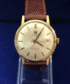 Reloj TISSOT VISODATE vintage de caballero, esfera de 34mm, en oro de ley 18 kts. con pulsera marrón de piel genuina. AUTOMÁTICO