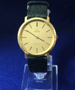 Reloj Omega De Ville, esfera de 34 mm, en oro de ley 18 kts., mecanismo de cuerda, con pulsera de piel color verde
