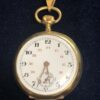 Reloj suizo de bolsillo con cronógrafo, realizado en oro amarillo de ley 18 kts.